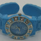Blue fashion bangle style watch with silicone strap and cubic zirconia's around the face