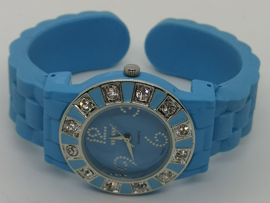 Blue fashion bangle style watch with silicone strap and cubic zirconia's around the face