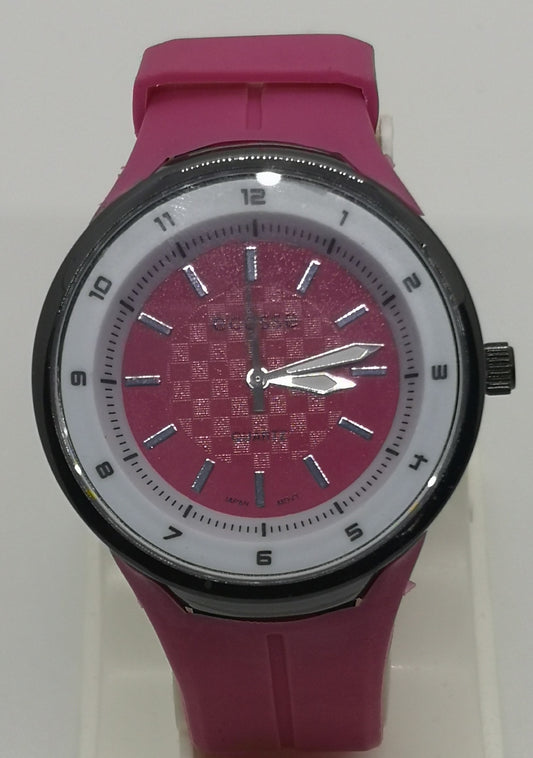 Pink watch with silicone strap and white bezel surrounding the pink dial with numbers