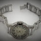 Silver base metal watch with rhinestones around crystal and white in center of strap
