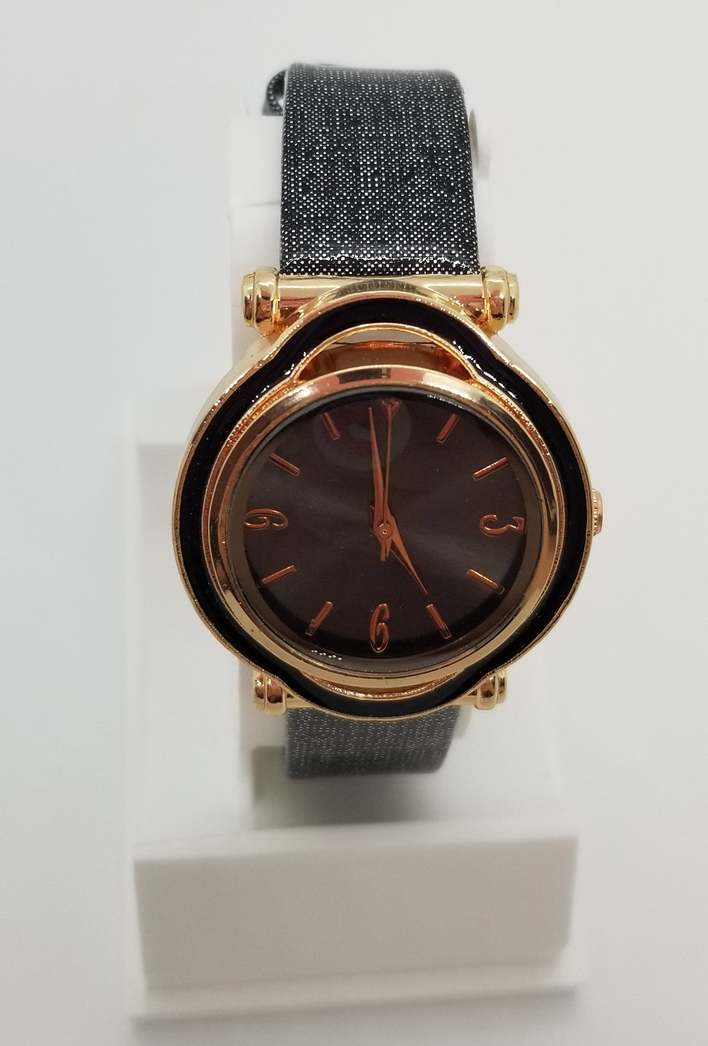 Gold plated base metal watch with black strap