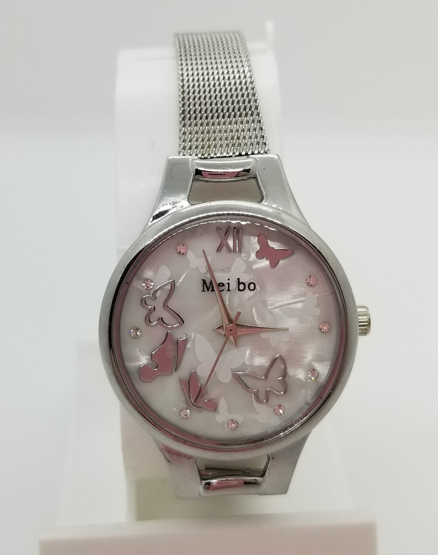 Silver base metal watch with butterflies on the dial of the